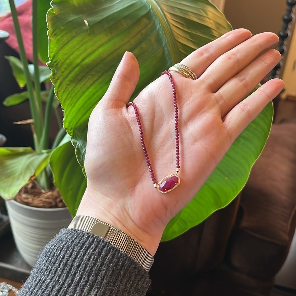 Kendra Scott burgundy beaded Elisa necklace on a gold chain